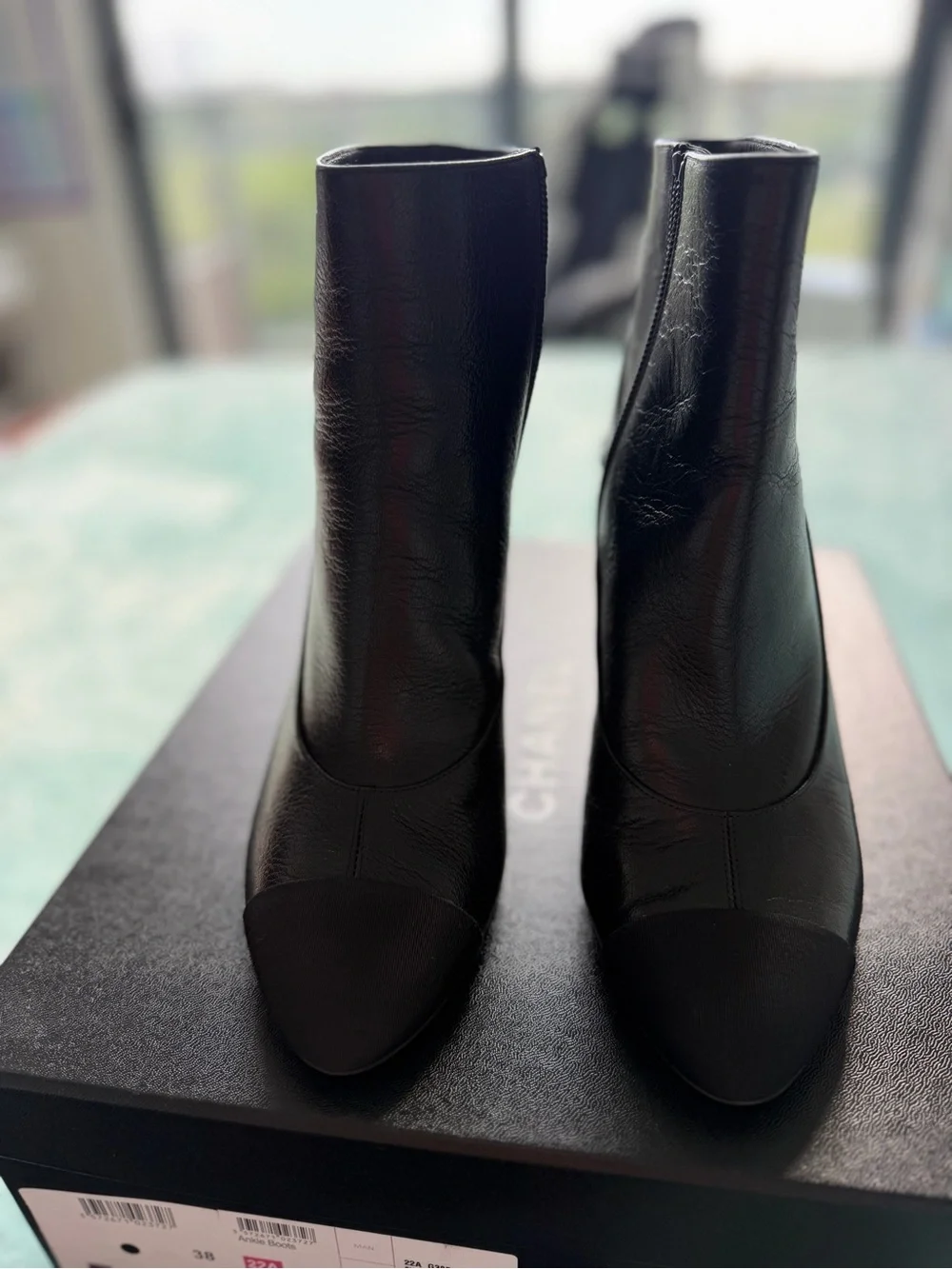 CHANEL Black Leather Ankle Booties with Black Cap Toe and Gold CC